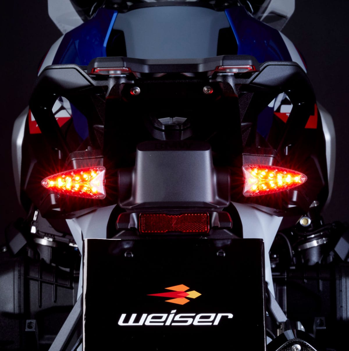 Weiser WeiserCAN EXT-CAN LED multifunction flashing light with plug-and-play installation, shown in a close-up on the product.