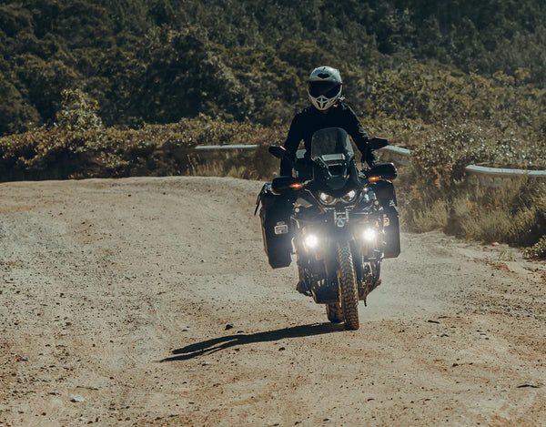 Denali CANsmart Gen 2 module for Honda Africa Twin 1100 motorcycle, mounted on handlebar for electronic control and customization.