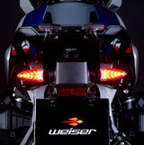 Weiser WeiserCAN EXT-CAN LED multifunction flashing light with plug-and-play installation, shown in a close-up on the product.