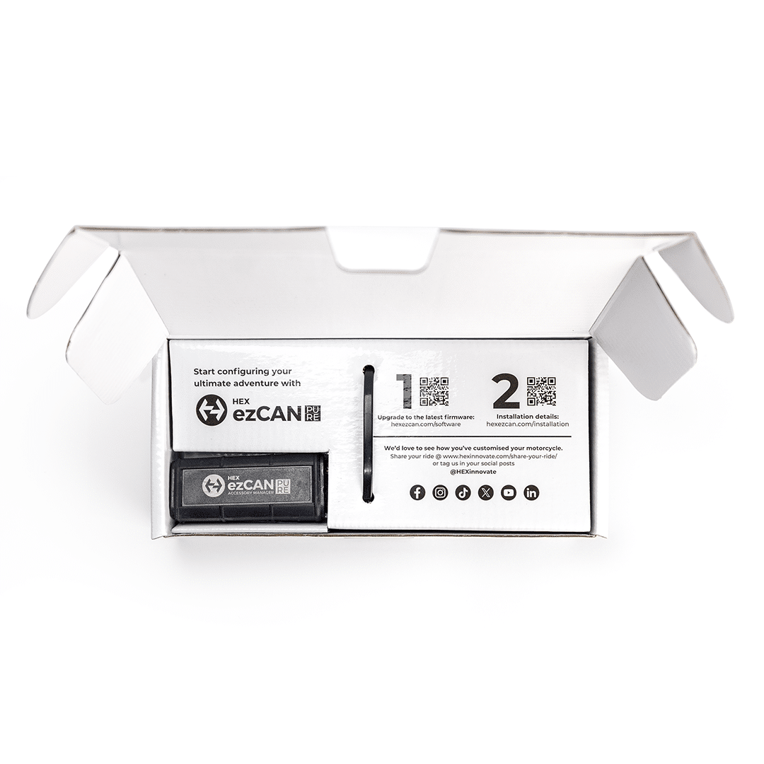 Open box of Hex Innovate HEX ezCAN PURE module showing its compact black control unit with wiring harness.