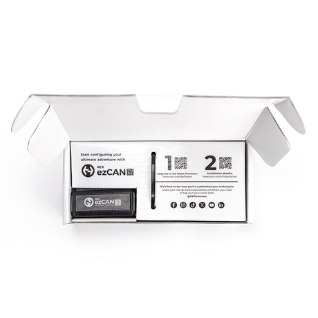 Open box of Hex Innovate HEX ezCAN PURE module showing its compact black control unit with wiring harness.