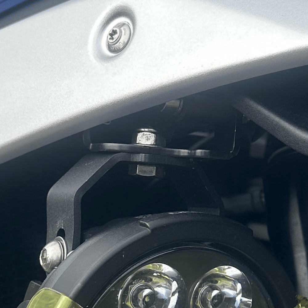 Hex Innovate BMW Type 1 mounting bracket for BMW R 1300 GS, shown attached to motorcycle in a lifestyle setting.