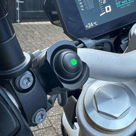 HEX ezSWITCH remote control from Hex Innovate with green LED lights, showcasing its sleek design and colorful LED indicators.