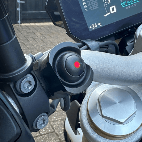 Hex Innovate HEX ezSWITCH remote control with red LED indicator and colorful LED lights on a black background.