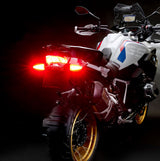 Weiser WeiserCAN EXT-CAN LED multifunctional turn signal light for vehicles, shown in a rear brake light setup.