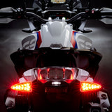 Weiser LED multifunctional turn signal light with plug-and-play installation, shown from rear angle on extreme-evo special vehicle.