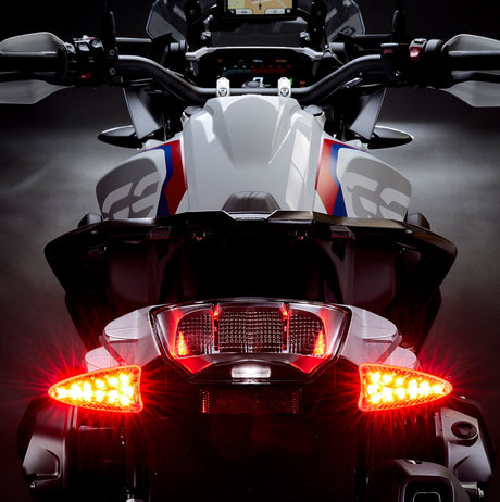 Weiser LED multifunctional turn signal light with plug-and-play installation, shown from rear angle on extreme-evo special vehicle.